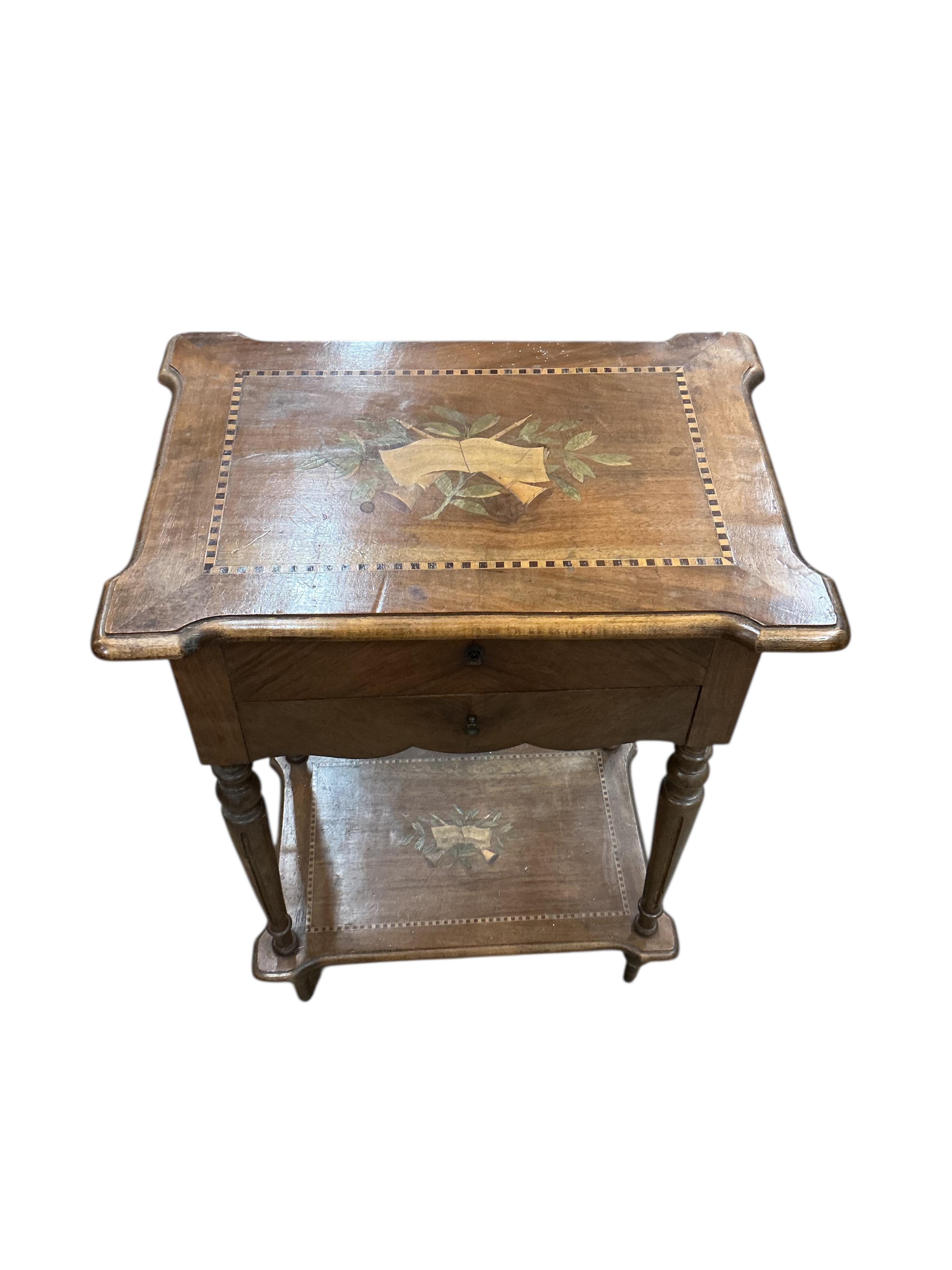 An early 20th century French marquetry inlaid walnut work table, width 52cm, depth 36cm, height 72cm